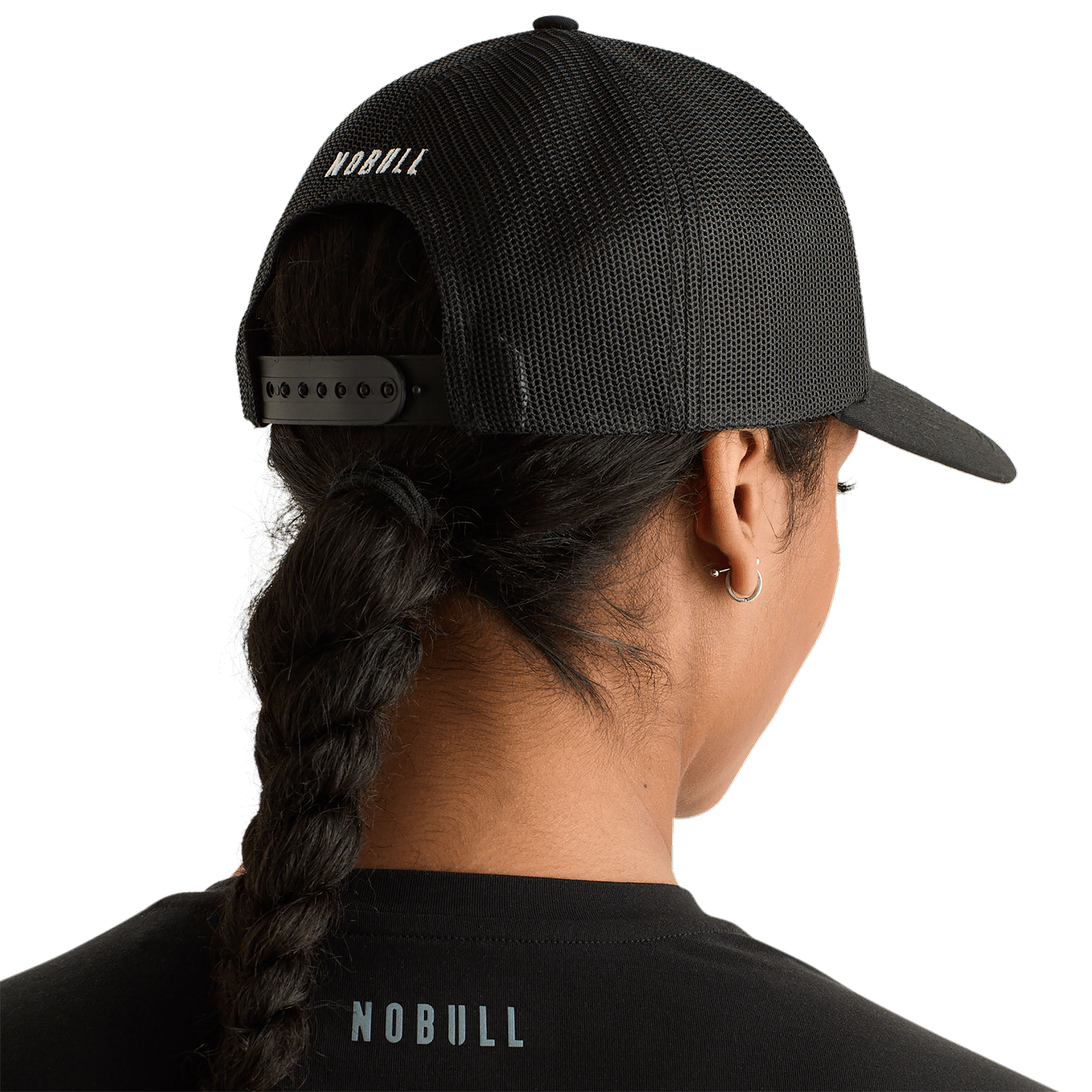 Woman Wearing Black Be U Trucker Hat Back Angle.