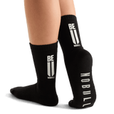 Woman Wearing Black Be U Crew Sock.