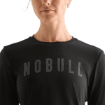 Black Women's NOBULL Long Sleeve Tee Detail Angle.
