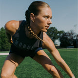 Woman in athletic wear on a grassy field