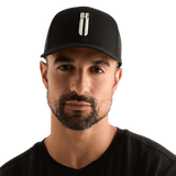 Man Wearing Black Be U Trucker Hat Front Angle.